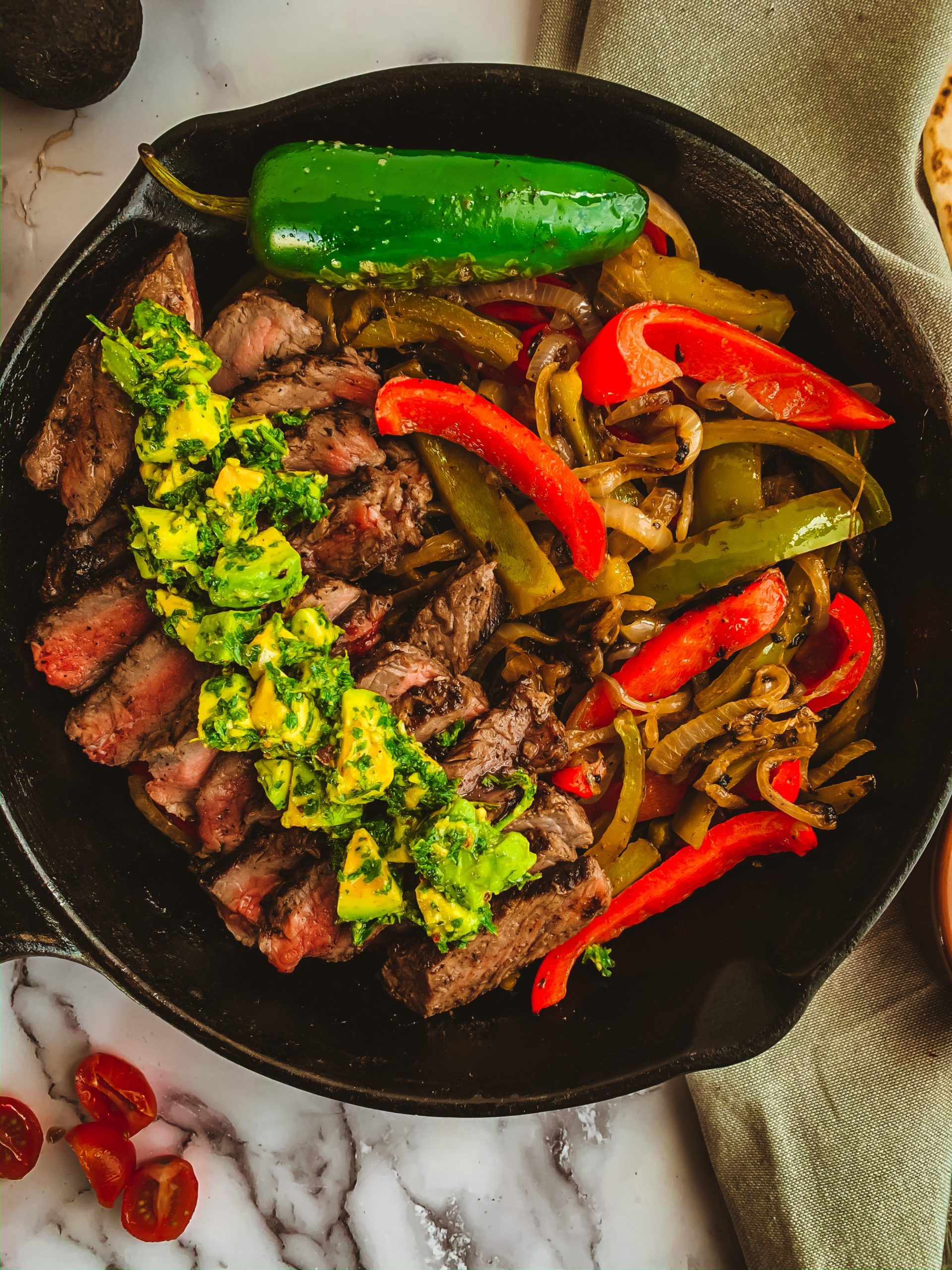 https://thecommunalfeast.com/wp-content/uploads/2020/04/steak-and-avocado-fajitas-11-scaled.jpg