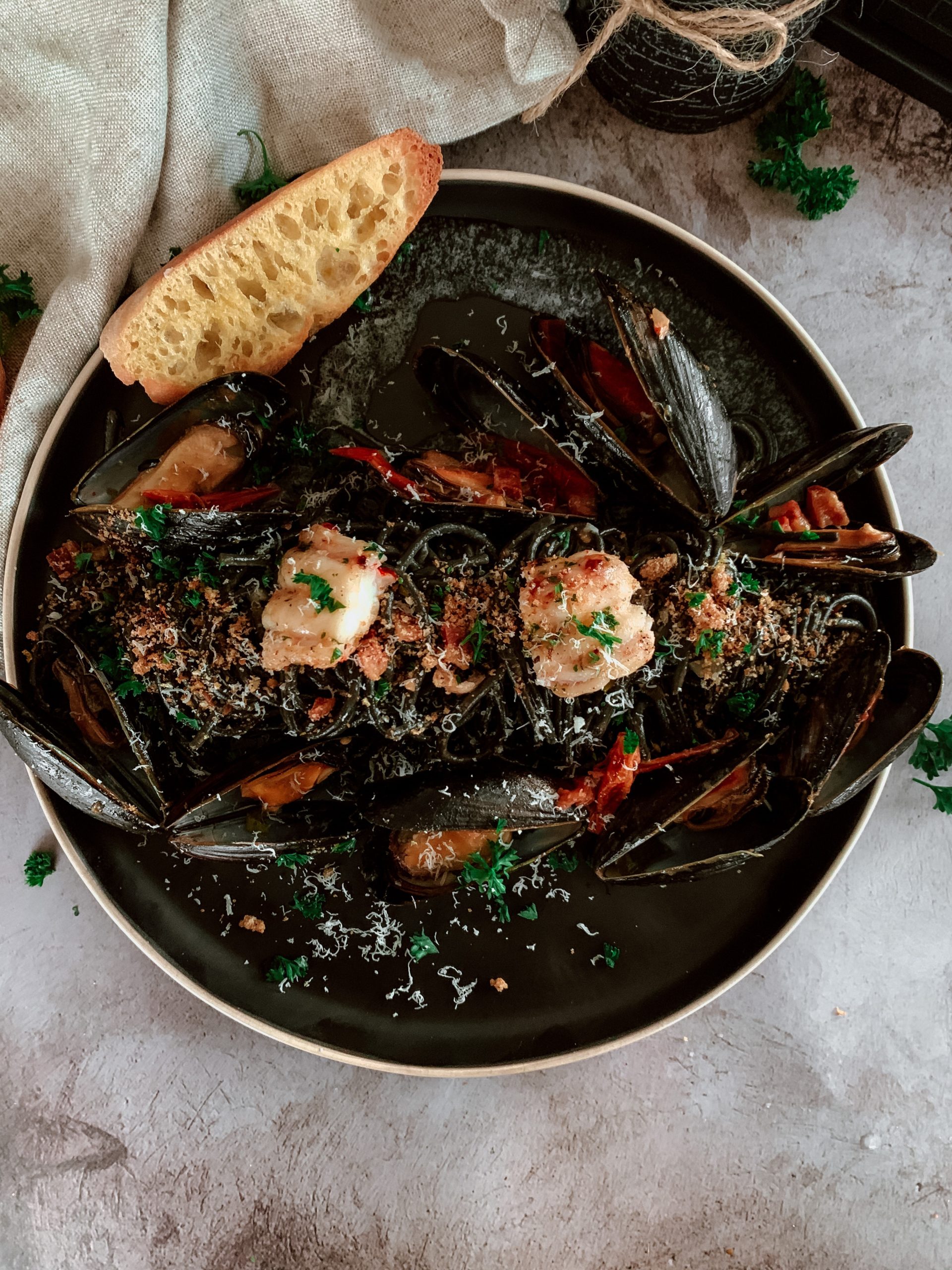 SQUID INK PASTA WITH LOBSTER & MUSSELS IN WHITE WINE 