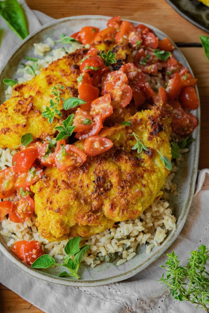 lemongrass chicken with marinated tomatoes over herbed rice